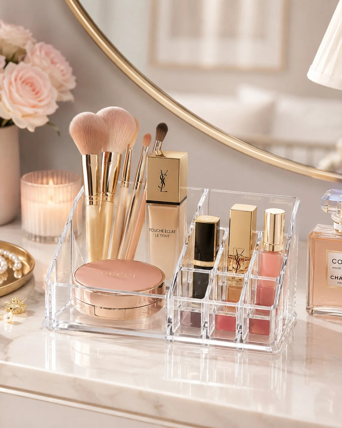 Clear acrylic makeup organizer styled on a vanity
