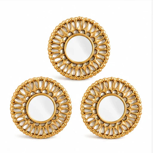 Set of three small golden round decorative wall mirrors on white background