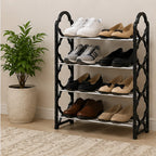 Four-tier black and silver shoe rack with shoes in a home entryway