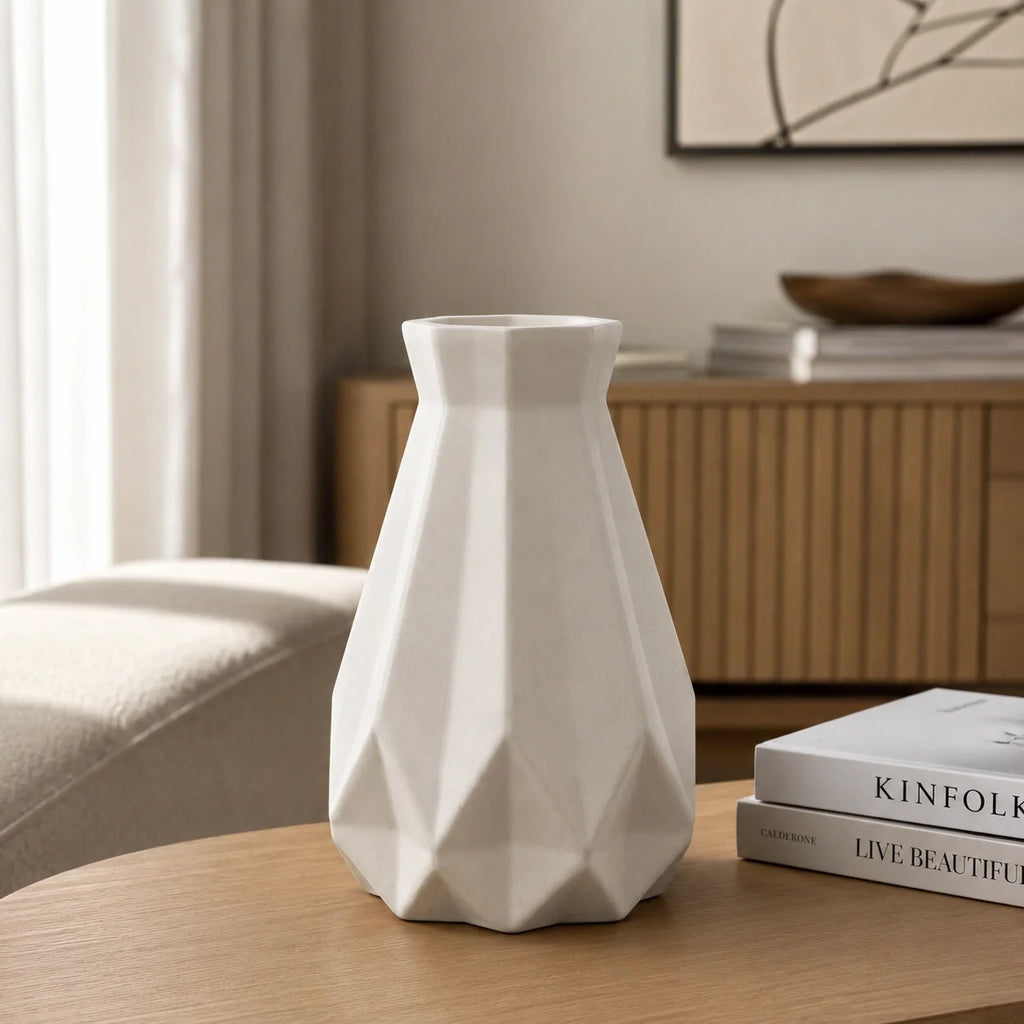 White Geometric Ceramic-Style Vase shown with decorative flowers