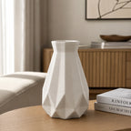 White Geometric Ceramic-Style Vase shown with decorative flowers
