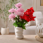 White Wavy Ceramic-Style Vase styled with artificial flowers